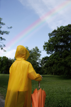 young boy looking at skyの写真素材