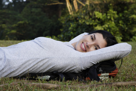 woman reclining on grassの写真素材