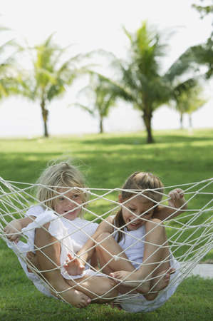 two girls in a hammockの写真素材