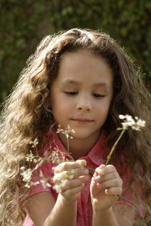 young girl with flowersの写真素材