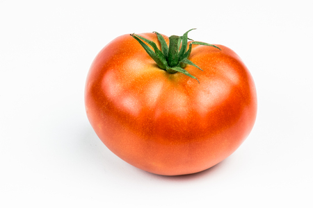 Tomatoes. Whole and a half isolated on whiteの写真素材