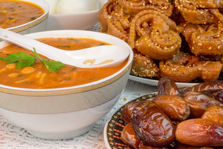 Bowl of Moroccan harira soup,chebakia, dates for iftarの写真素材