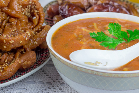 Bowl of Moroccan harira soup,chebakia, dates for iftarの写真素材