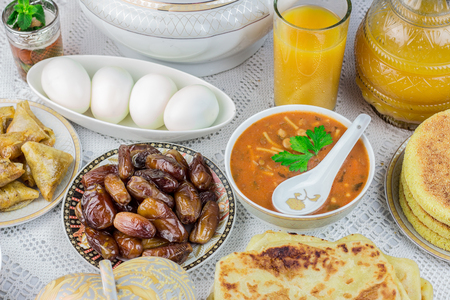 Bowl of Moroccan harira soup,chebakia, dates for iftarの写真素材