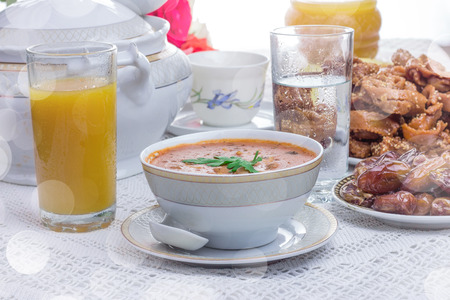 Bowl of Moroccan harira soup,chebakia, dates for iftarの写真素材