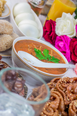 Bowl of Moroccan harira soup,chebakia, dates for iftarの写真素材
