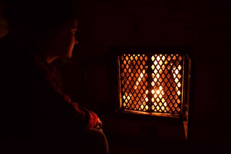 Girl by the fireplace