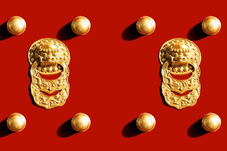 Detail and Texture of Chinese Royal Red Gates with Golden Lionの写真素材