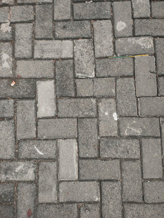 Cobblestone walkway in the city. Abstract background.