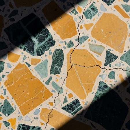 Hairline Stress Crack Across Vintage Mid-Century Terrazzo Floor Texture Detail.