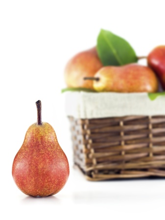 Pear with a basket full of pears on a white backgroundの写真素材