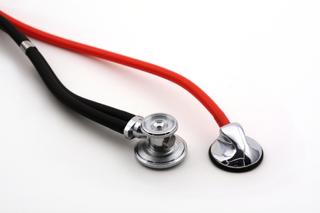 Two isolated stethoscopes over white, concept of second medical opinionの写真素材