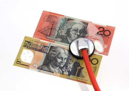 Stethoscope with Australian banknotes, isolated over whiteの写真素材