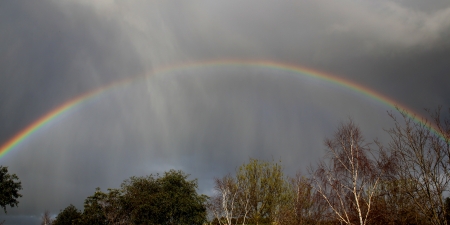 Beautiful rainbow on a stormy day   Concept of hope even during tough times の写真素材