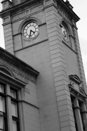 Clock tower of an old building, in black and whiteの写真素材
