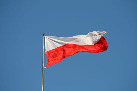 Polish flag on the wind, yellow stars