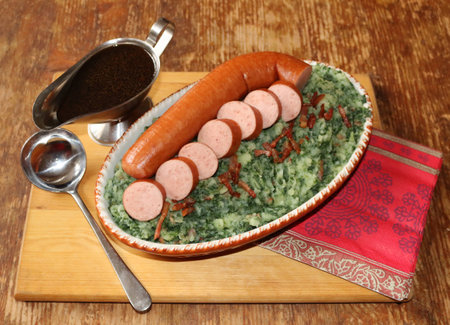 Delicious colcannon with kale, fried bacon, sausage and gravyの写真素材