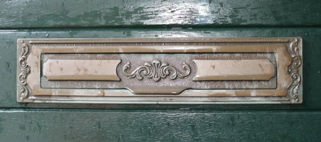 Old fashioned copper mail slotの写真素材