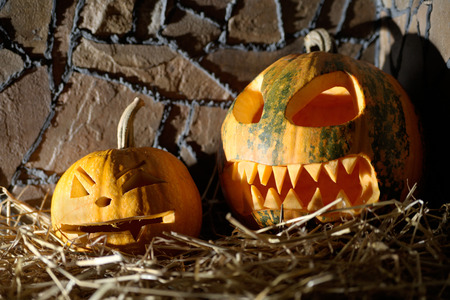 Pumpkin Face in hay. Halloween celebration.の写真素材