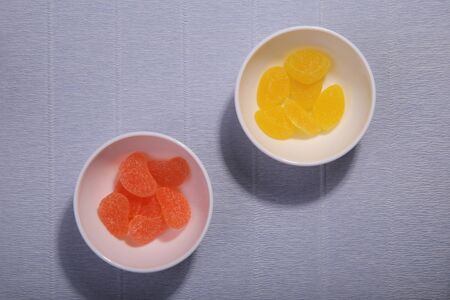 Plates with sweets. Marmalade on the dish. White dishes. Marmalade slices.の写真素材