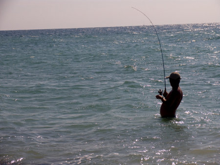 Fishing at the middle of the beachのeditorial素材