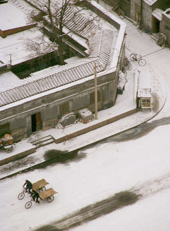 Carpet of snow surrounded the village streetsの写真素材