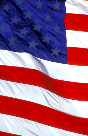 American flag flying in the skyの写真素材