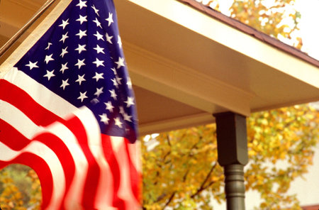 American flag flying in the skyの写真素材