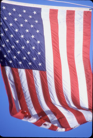 American flag flying in the skyの写真素材