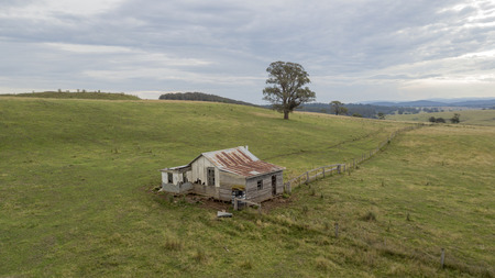 abandoned house on the hill aerial photoの写真素材
