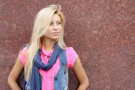portrait of the young woman on a background of a wallの写真素材
