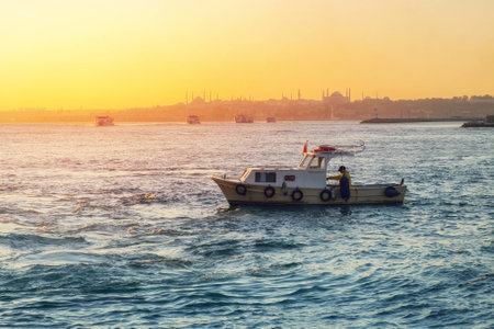 Evening Bosphorus sunset with boat Istanbul Octoberの写真素材