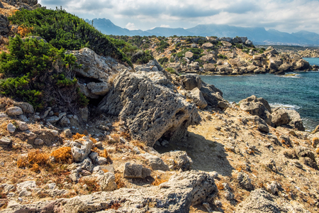 Cyprus rocky coatline desert cliff stones seaの写真素材