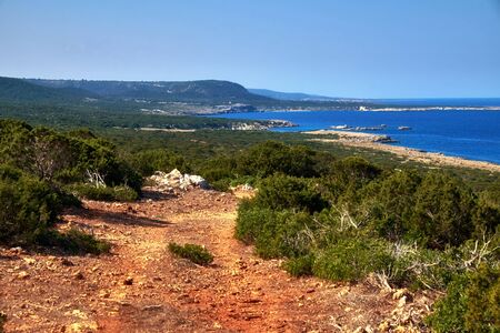 Summer landscape of Northern Cyprus in Dipkarpaz national park with rocks and bushesの写真素材