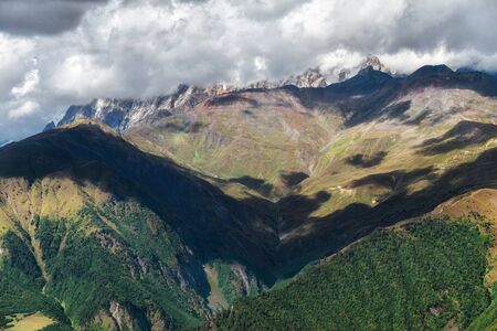 View to mountains from Hatsvali ski resort sunny autumn day in Svaneti Georgiaの写真素材