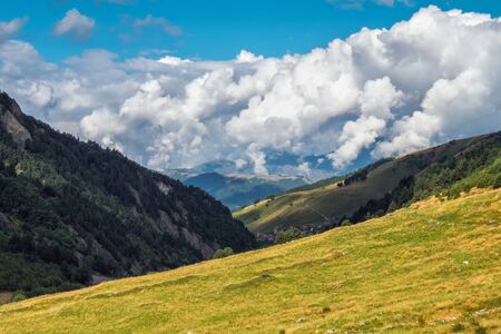 Scenic nature cloudscape in Svaneti mountains Georgia green meadows pastureの写真素材