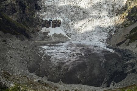 close up view to glacier in mountains of Svaneti Georgia with small tongue and big kar because of global warmingの写真素材
