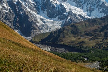 Mountain walls with glacier and its tongue Svaneti Georgiaの写真素材