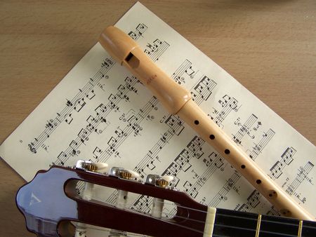 guitar and flute with sheet musicの写真素材