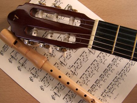 guitar and flute with sheet musicの写真素材