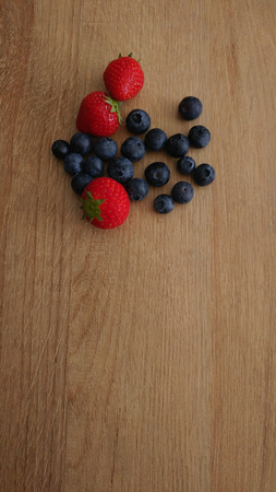 Healthy Berries on Wooden Background with textspaceの写真素材