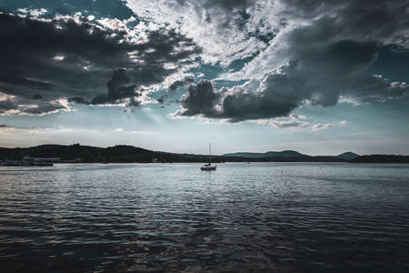 A cloudy before-thunderstorm afternoon at Lake Memphremagog, from New Port, Vermontの写真素材