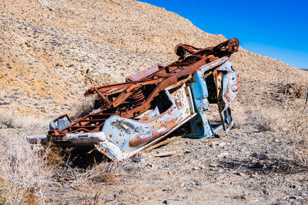 an abandoned car found upside down in desert, Mojave Desert, Death Valley National Park, Californiaのeditorial素材