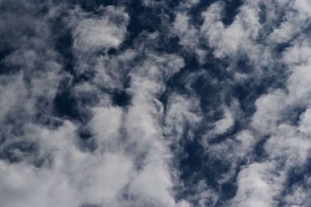 Dark blue sky with nice clouds purl, something menacing