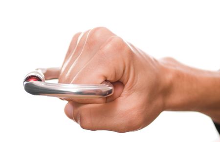 Man's hand holding a carbine like knuckle-duster making a fistの写真素材