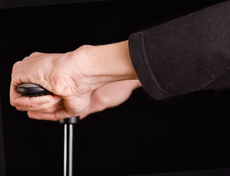 Hands of a man filling by pumping something isolated on black backgroundの写真素材