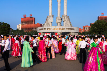 Pyongyang, North Korea - July 27, 2014: Mass dance in honor of victory day in the war at the monument of the workers ' party of Korea on 27 July 2014.のeditorial素材