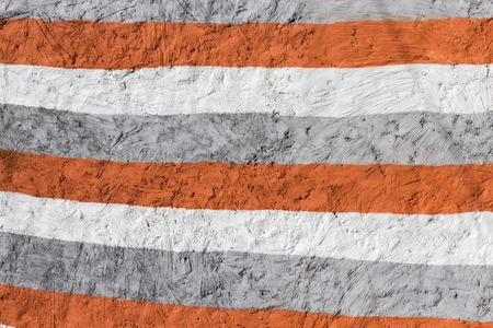 colored horizontal lines on a concrete wall, backgroundの写真素材