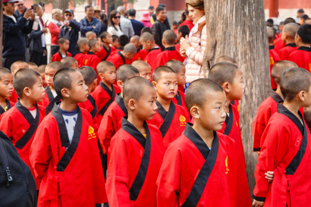 Dengfeng, China - October 16, 2018: Pupils of the martial arts school are on the square near the Shaolin Temple.のeditorial素材