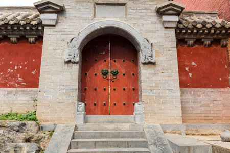 Dengfeng, China - October 17, 2018: An old style stone door inside Shaolin Temple songshan dengfeng city henan province China.のeditorial素材